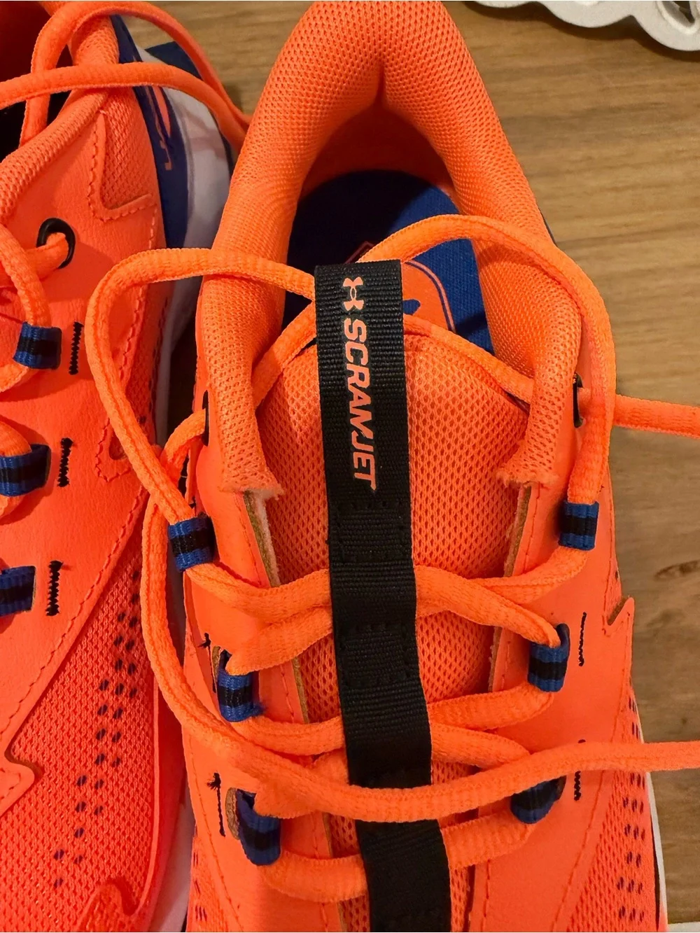 Under Armour Bright Orange Kids Sneakers with Black Accents